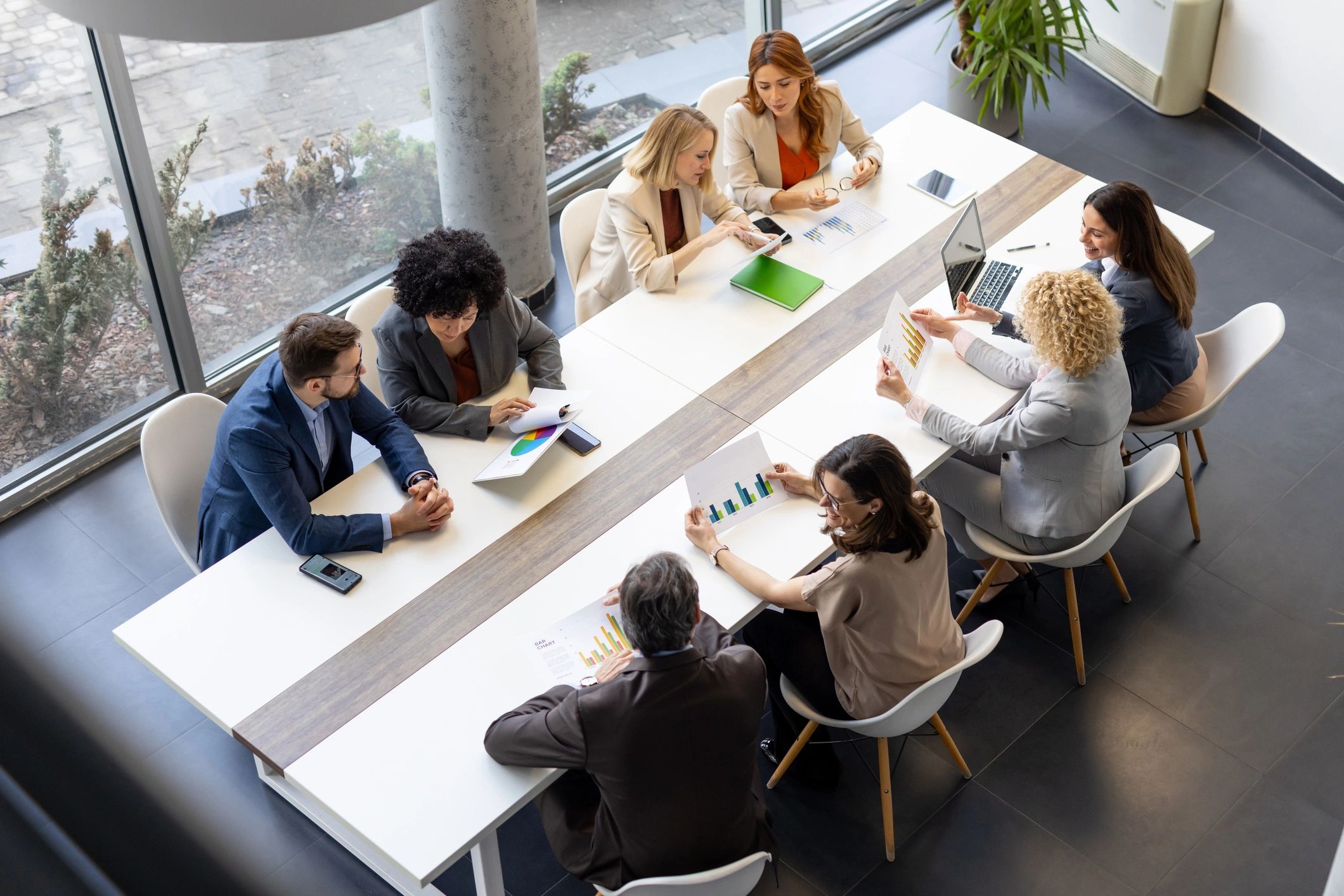 Financial advisory team meeting with clients in a modern office