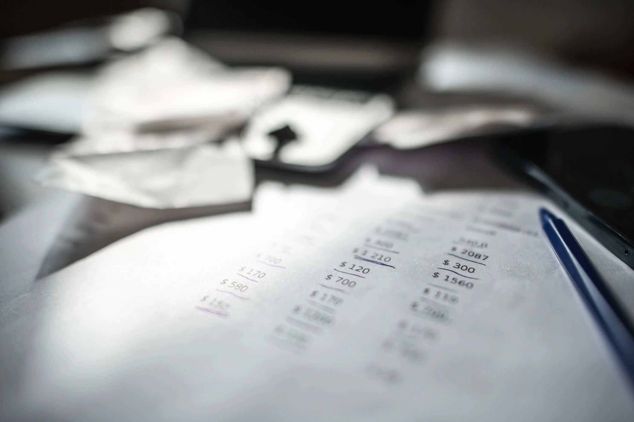 Financial reports and laptop on a desk